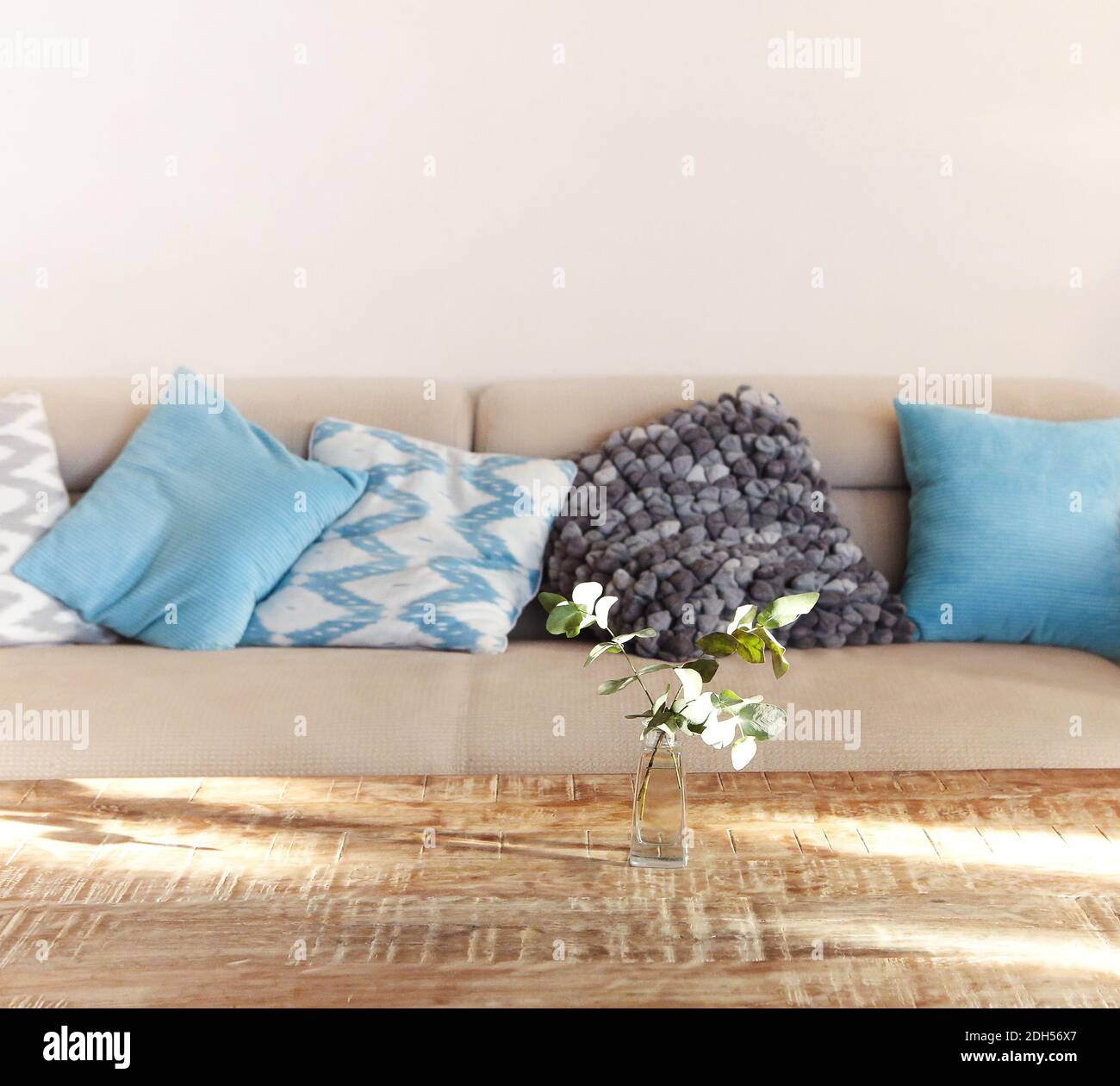 Table and sofa in living room Stock Photo - Alamy