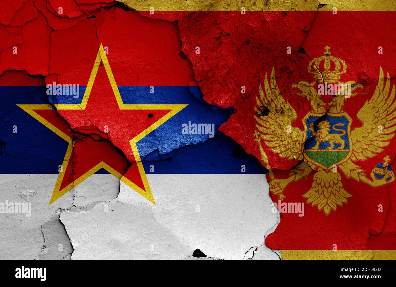 Historical flag of Socialist Republic of Montenegro and today Montenegro flag on cracked wall Stock Photo