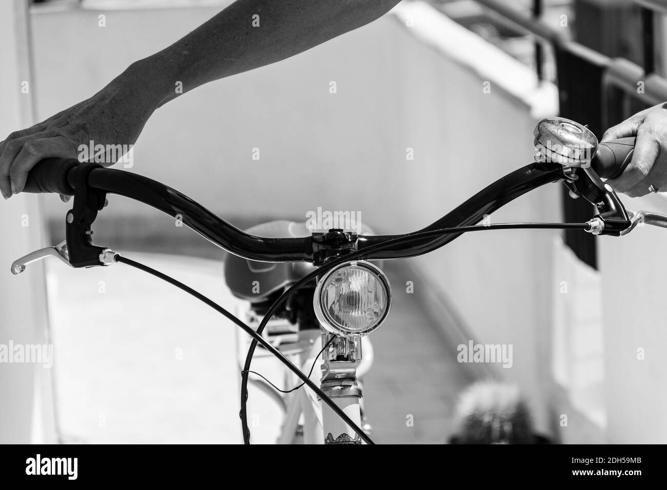 A grayscale closeup shot of a hybrid bicycle Stock Photo