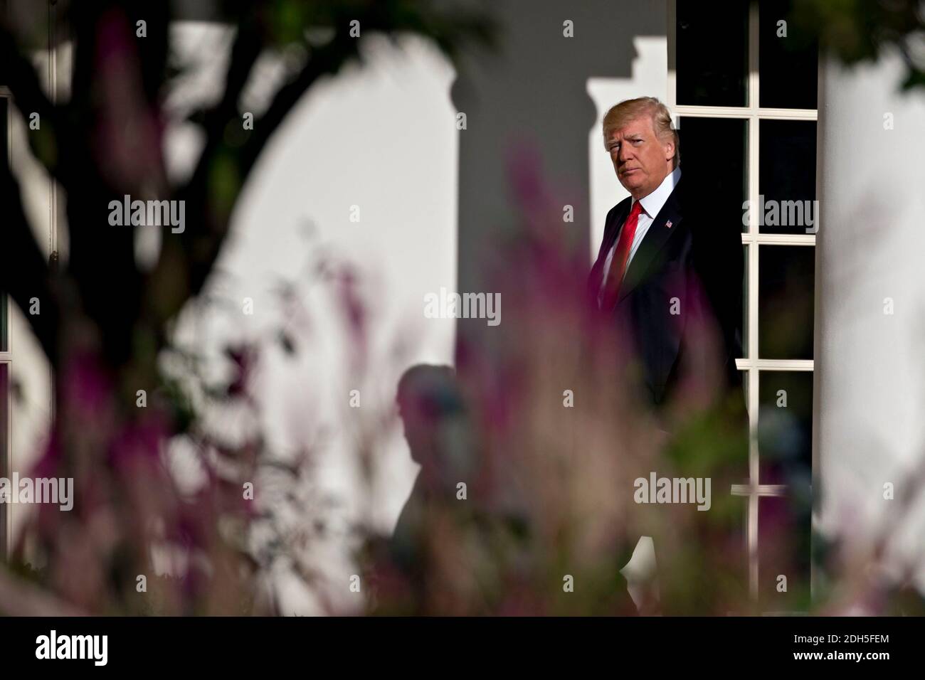 U.S. President Donald Trump walks toward Oval Office of the White House ...