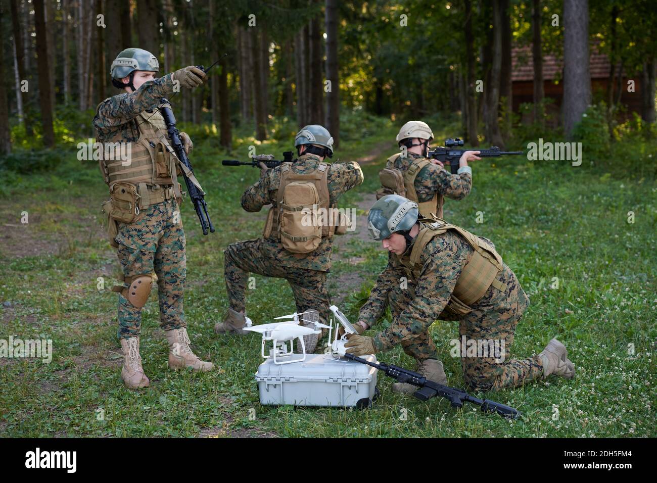 Soldiers Squad are Using Drone for Scouting Stock Photo