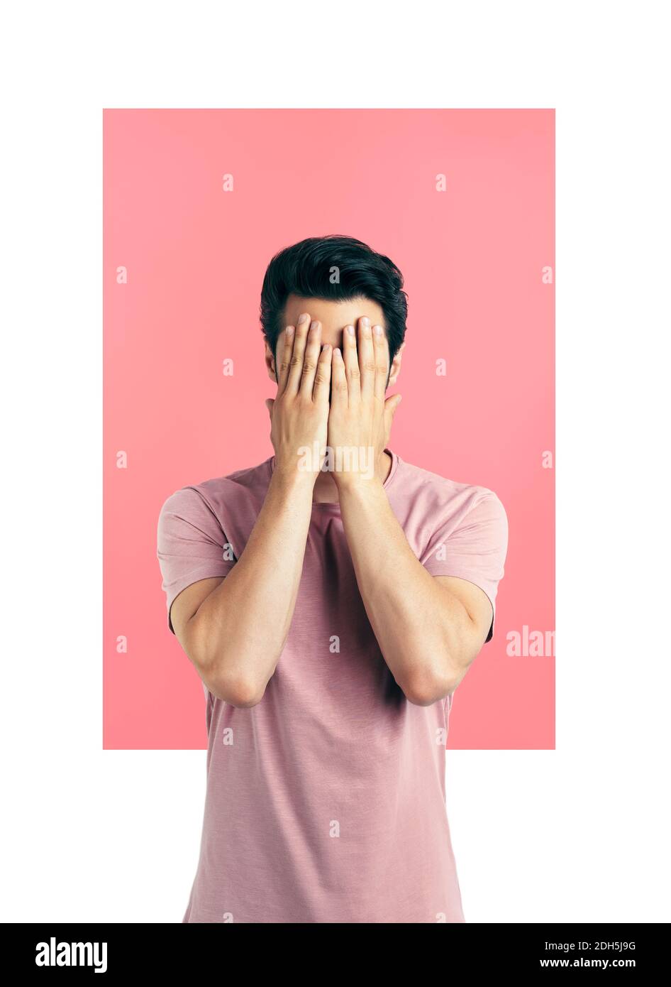 Portrait of stressed despair man closed face by two hands Stock Photo