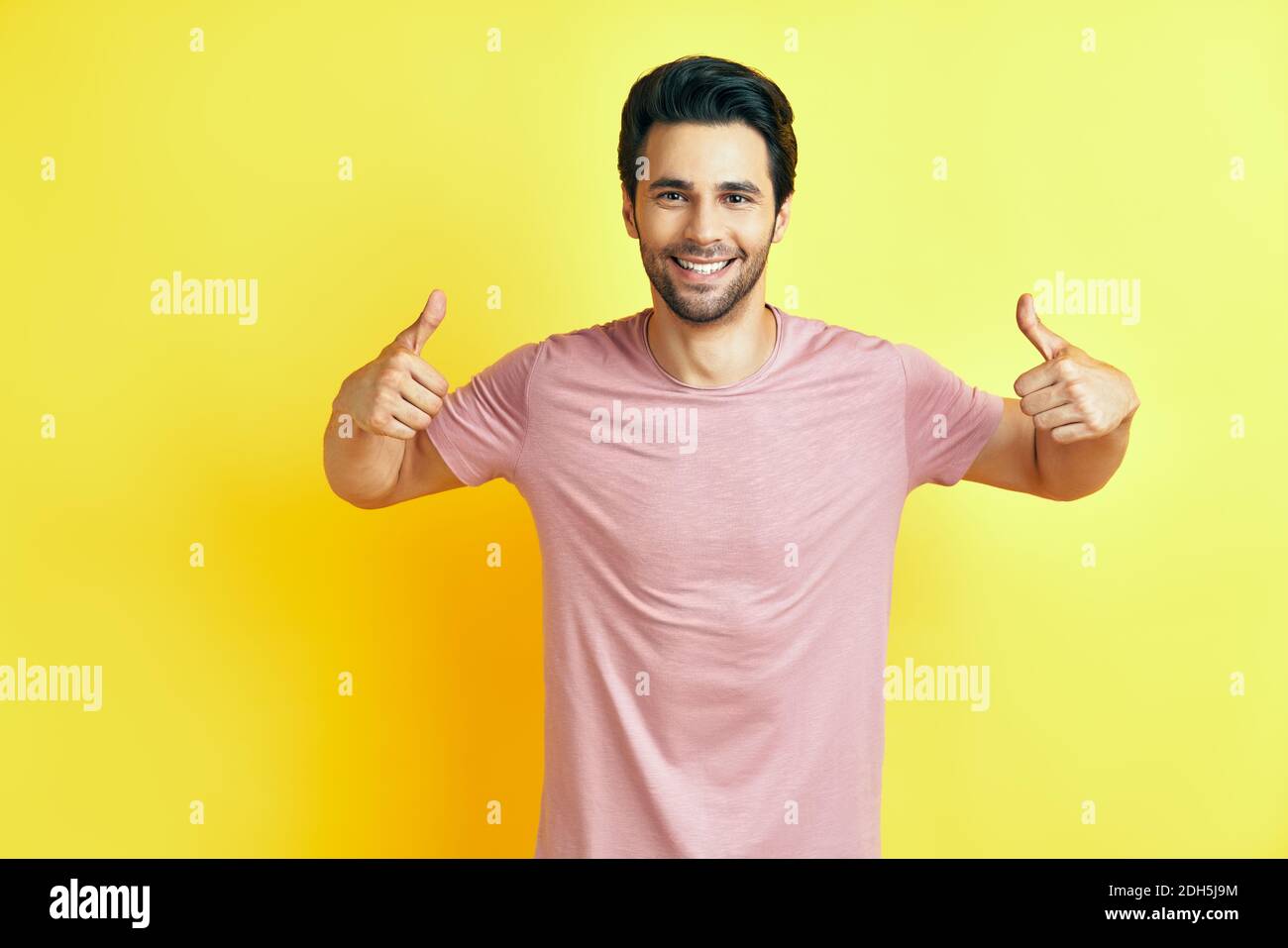 Male hand with thumbs up sign, isolated on white background Stock