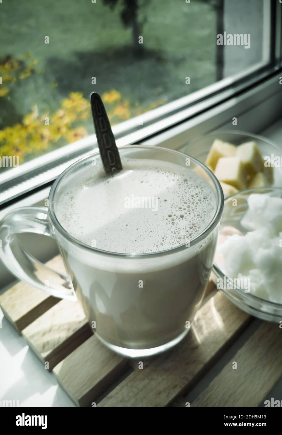 Bulletproof coffee: coffee whipped with cream and coconut oil. Stock Photo