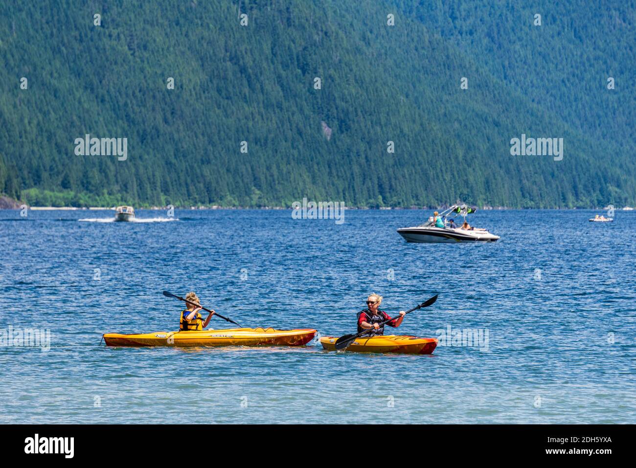 MAPLE RIDGE, CANADA - JUNE 28, 2020: Alouette Lake view from South Beach green mountains and white clouds. Stock Photo