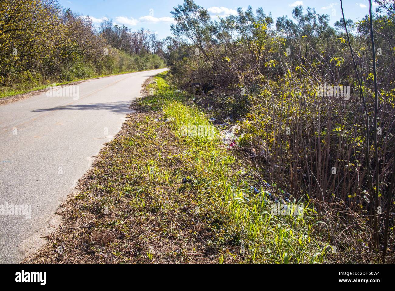 A road in the country with trash on the side of the road scene Stock ...
