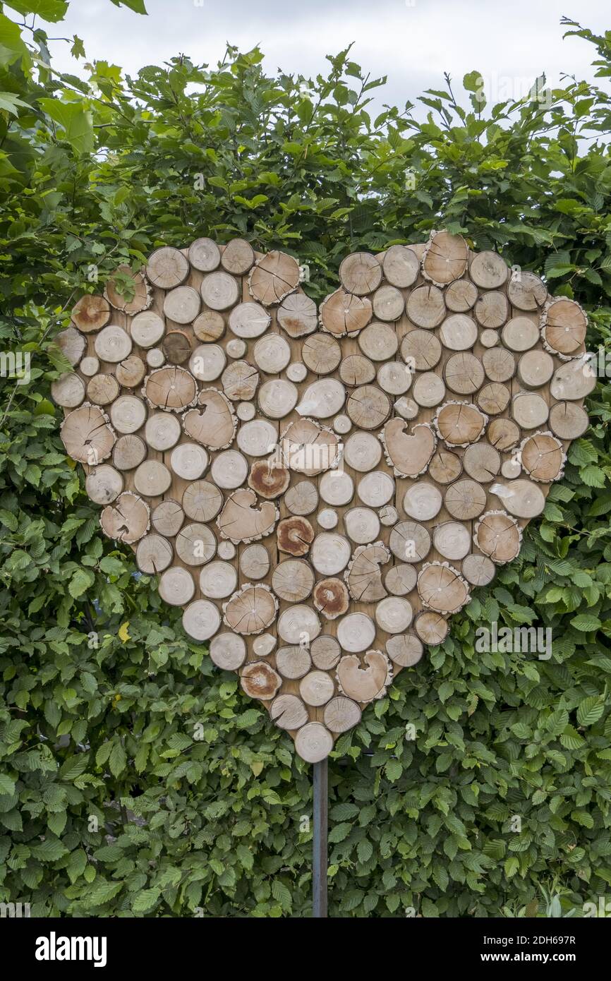 Wooden heart with wooden plates Stock Photo