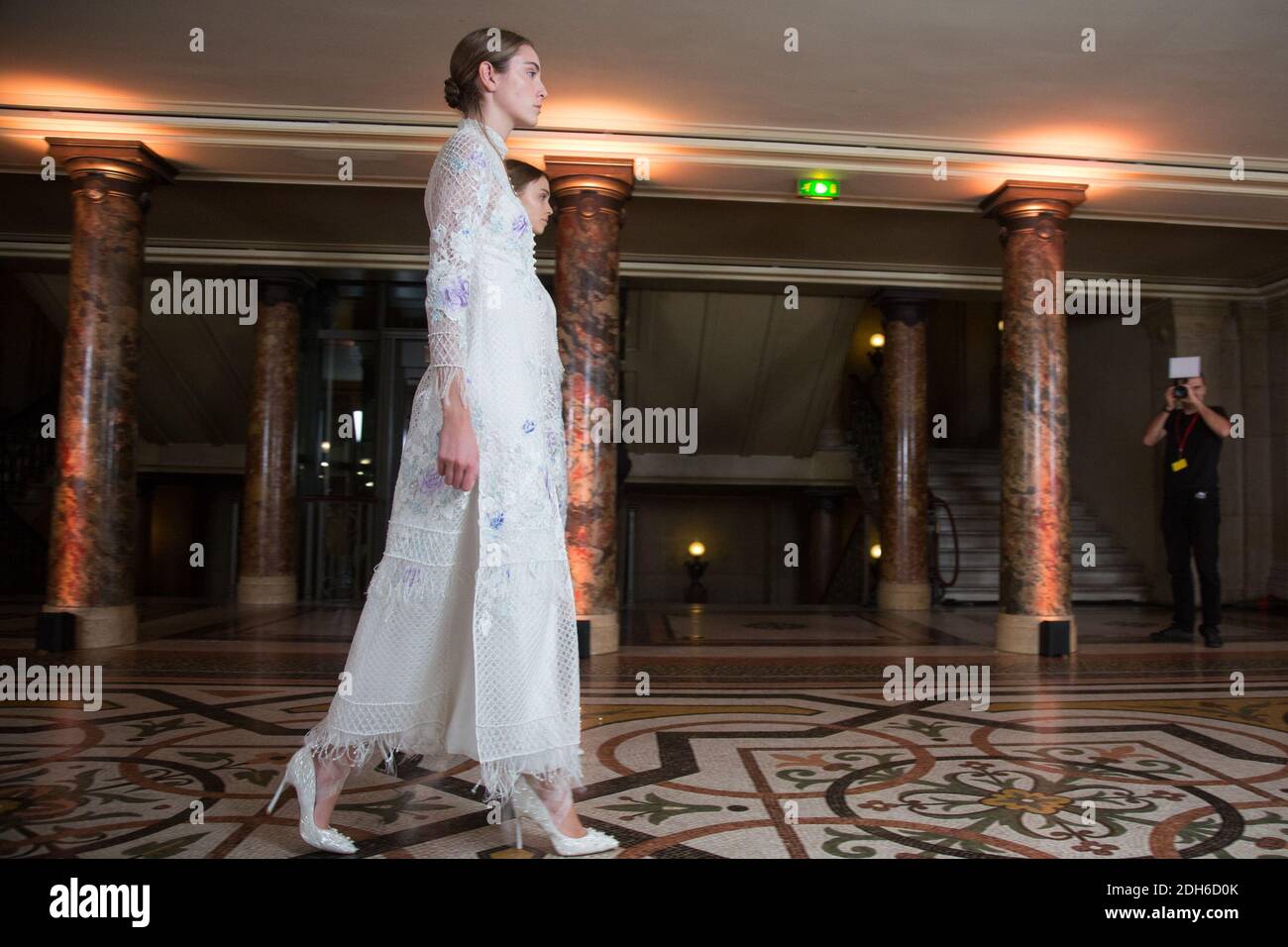 A models displays a creation designed by Ying Xiong on the runway ...