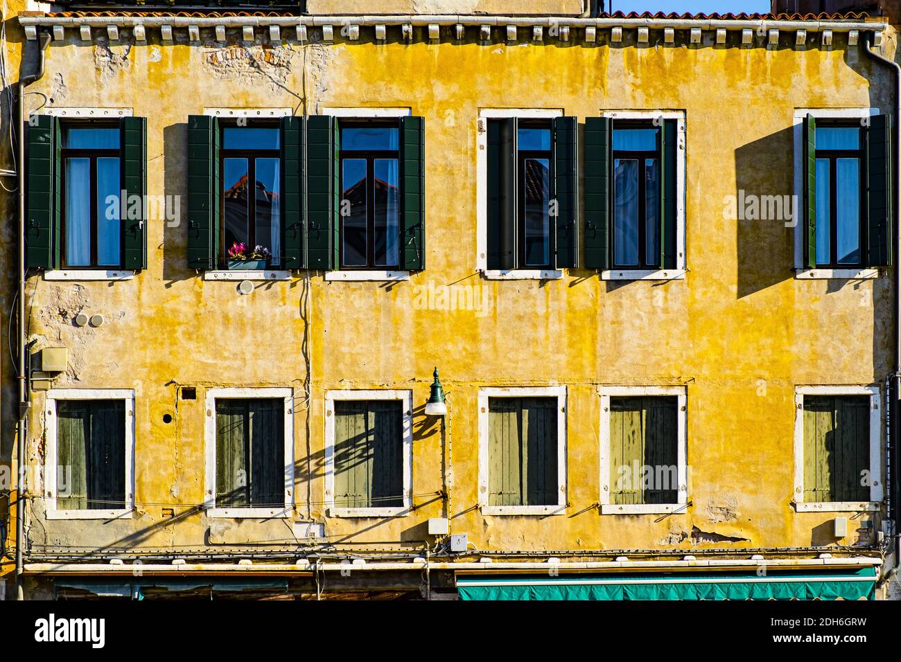 Italian culture on Venetian facades. Stock Photo