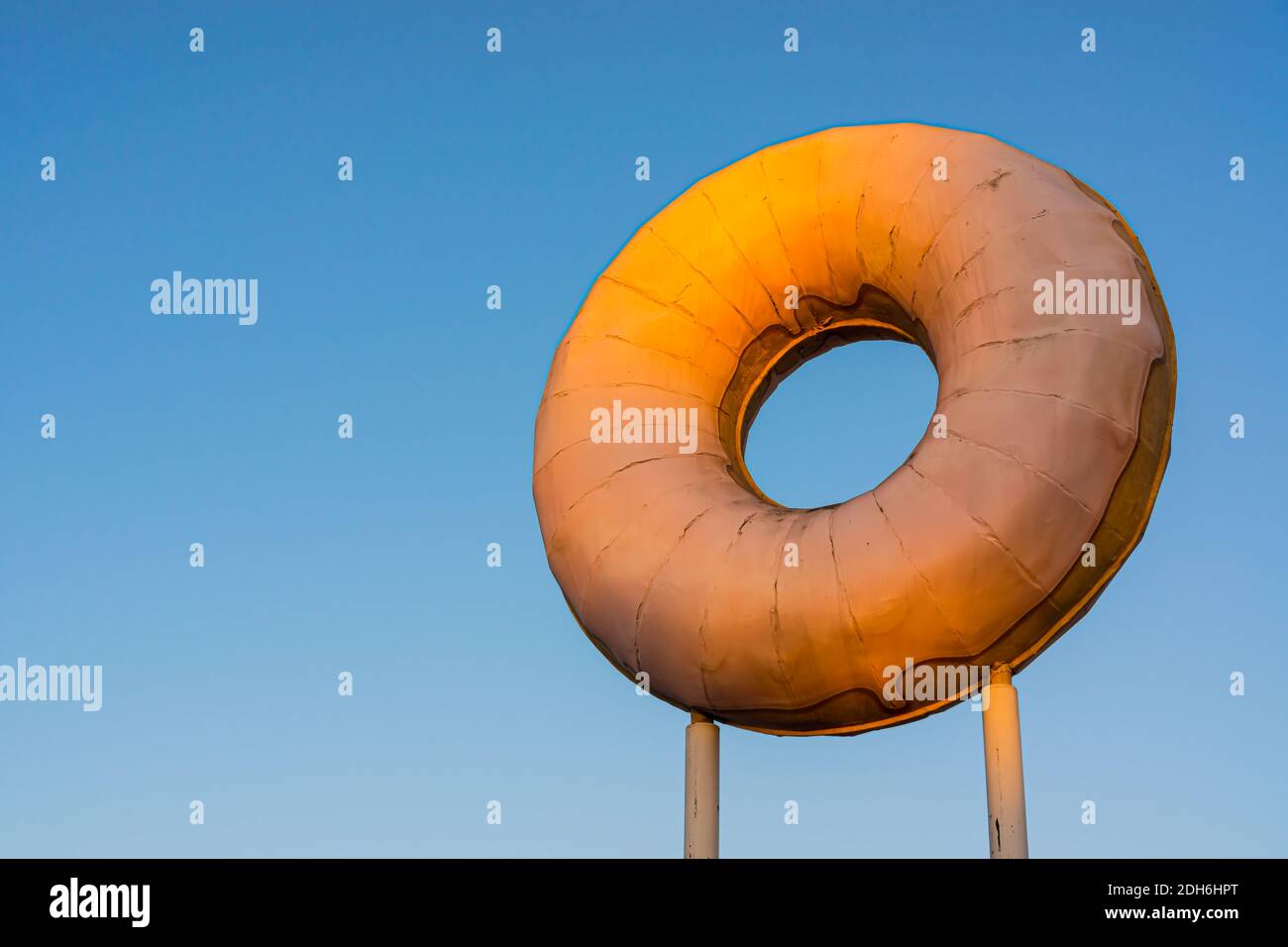 Large Donut Display Outside Donut Shop Stock Photo