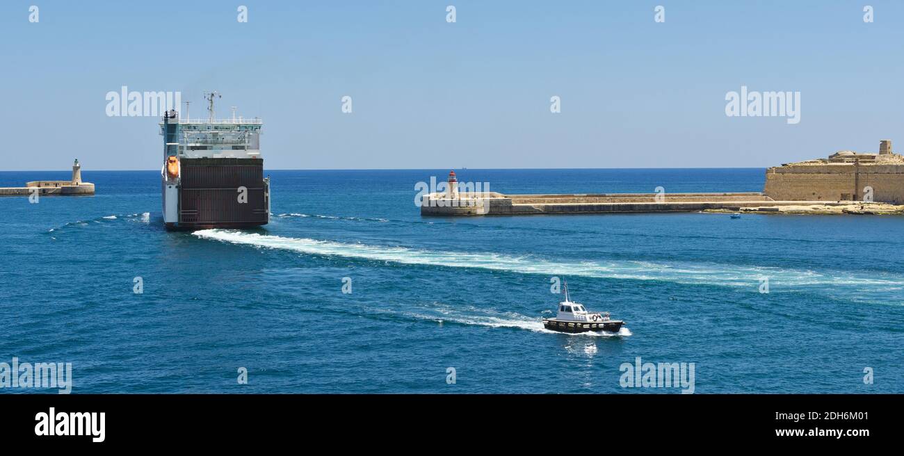 Ship leaves the harbor Stock Photo Alamy