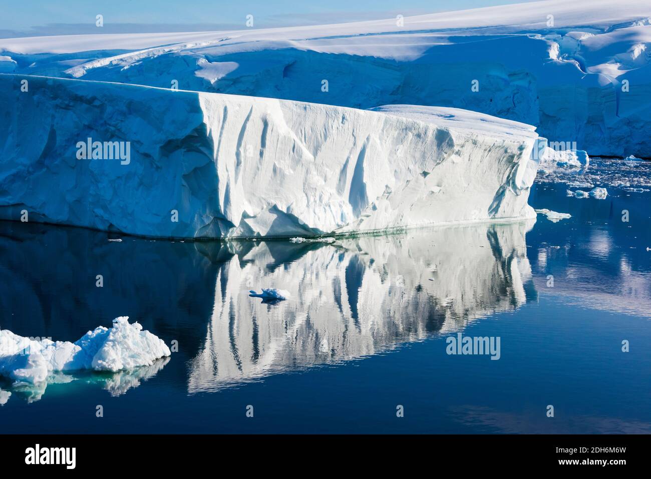 Iceberg with reflection in South Atlantic Ocean, Antarctica Stock Photo