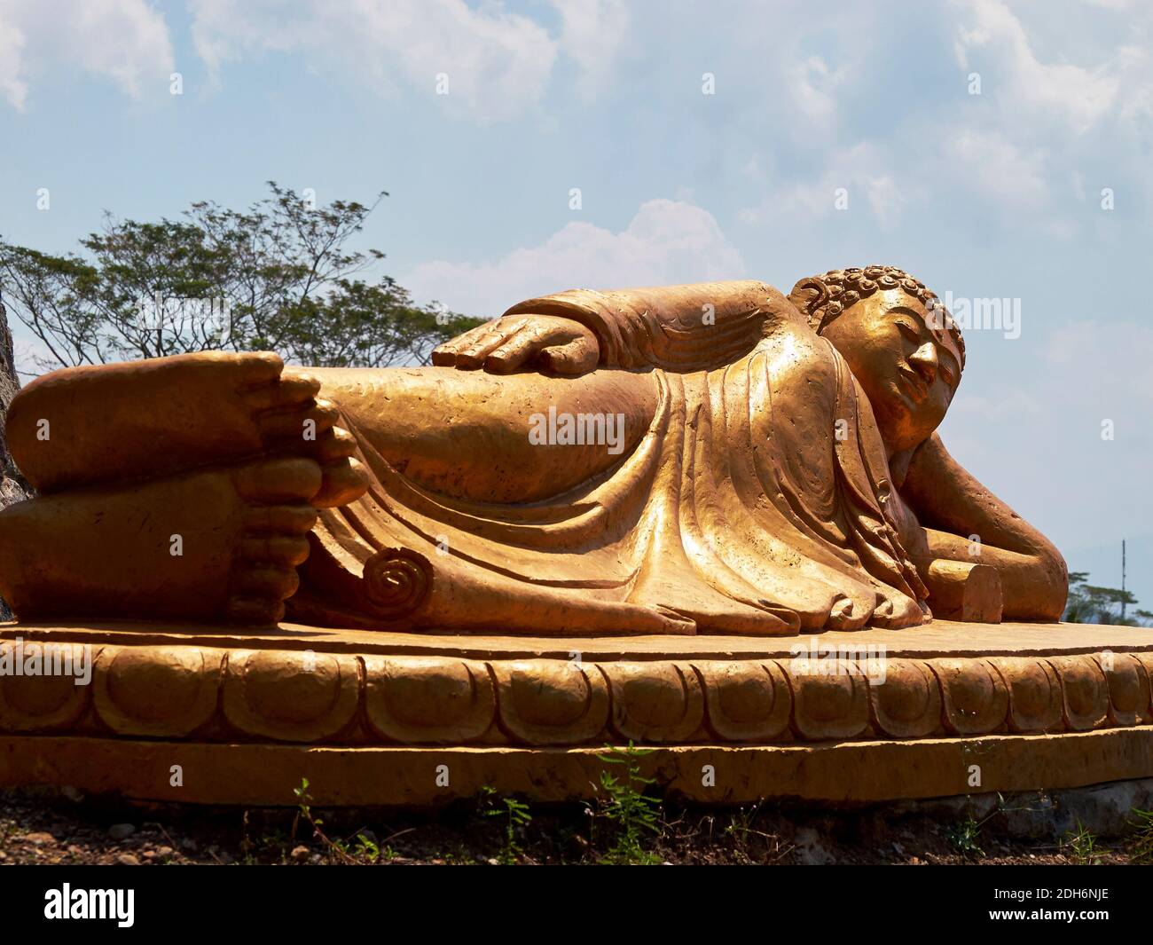 Central Java, Indonesia - August 26, 2020 : A large sleeping buddha statue was taken from his feet Stock Photo