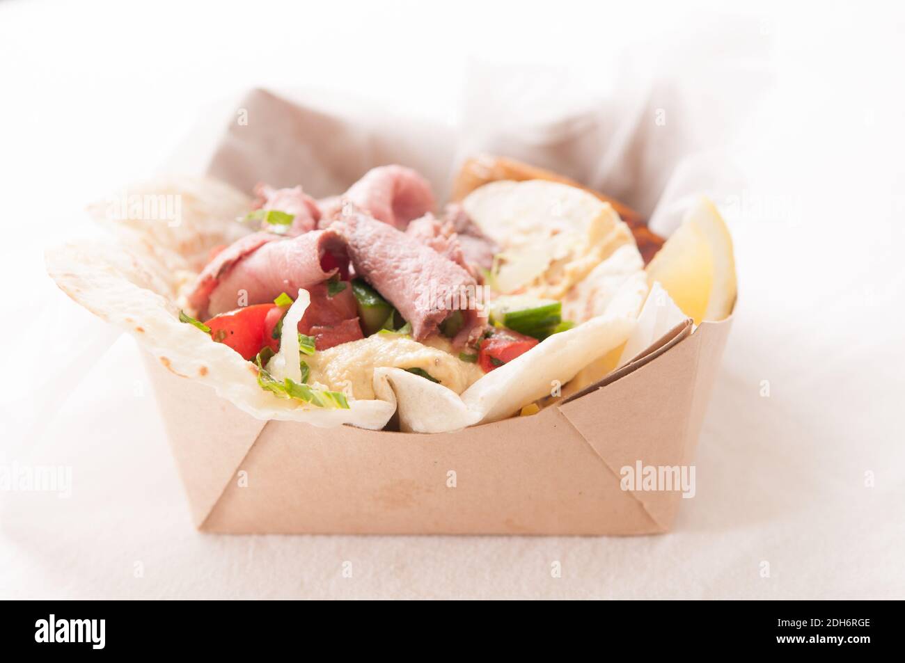 food truck meal of lamb wrap with roasted potato, shawarma style with