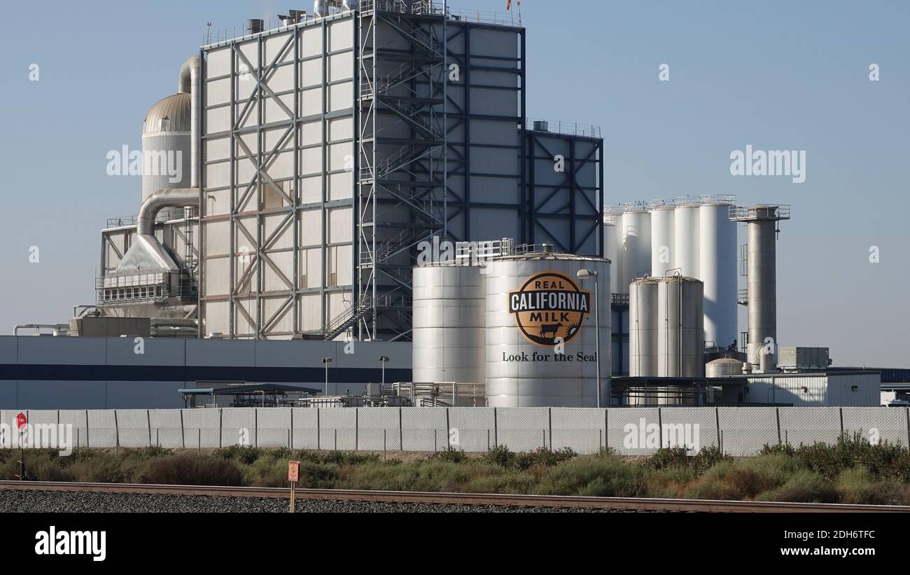 CA, USA - Oct. 19, 2020: An industrial milk processing factory is shown with a sign reading “REAL CALIFORNIA MILK", "Look for the Seal" displayed. Stock Photo