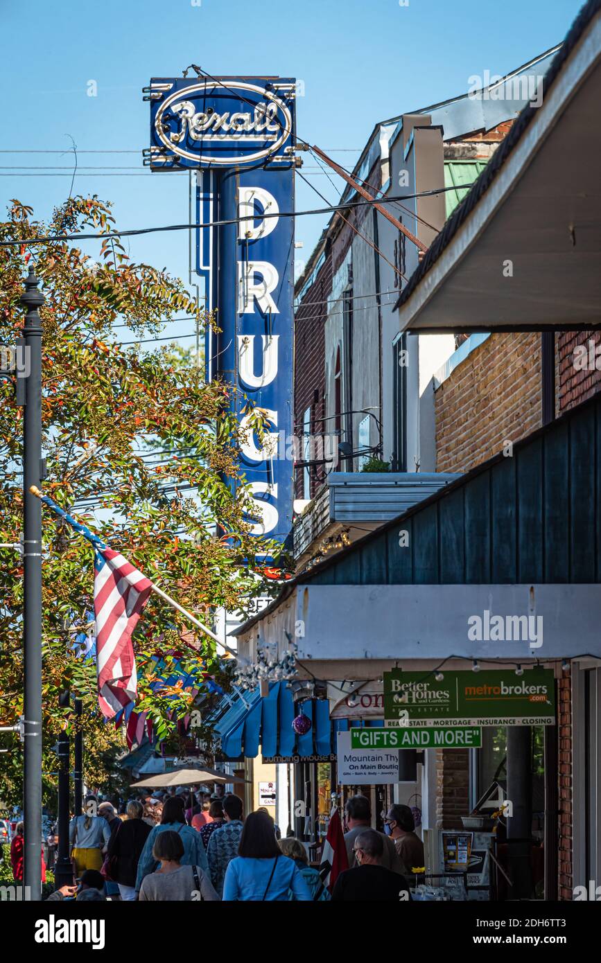 Crowded sidewalk in downtown Blue Ridge, Georgia on a beautiful autumn day where people are wearing face masks due to the COVID-19 pandemic. (USA) Stock Photo