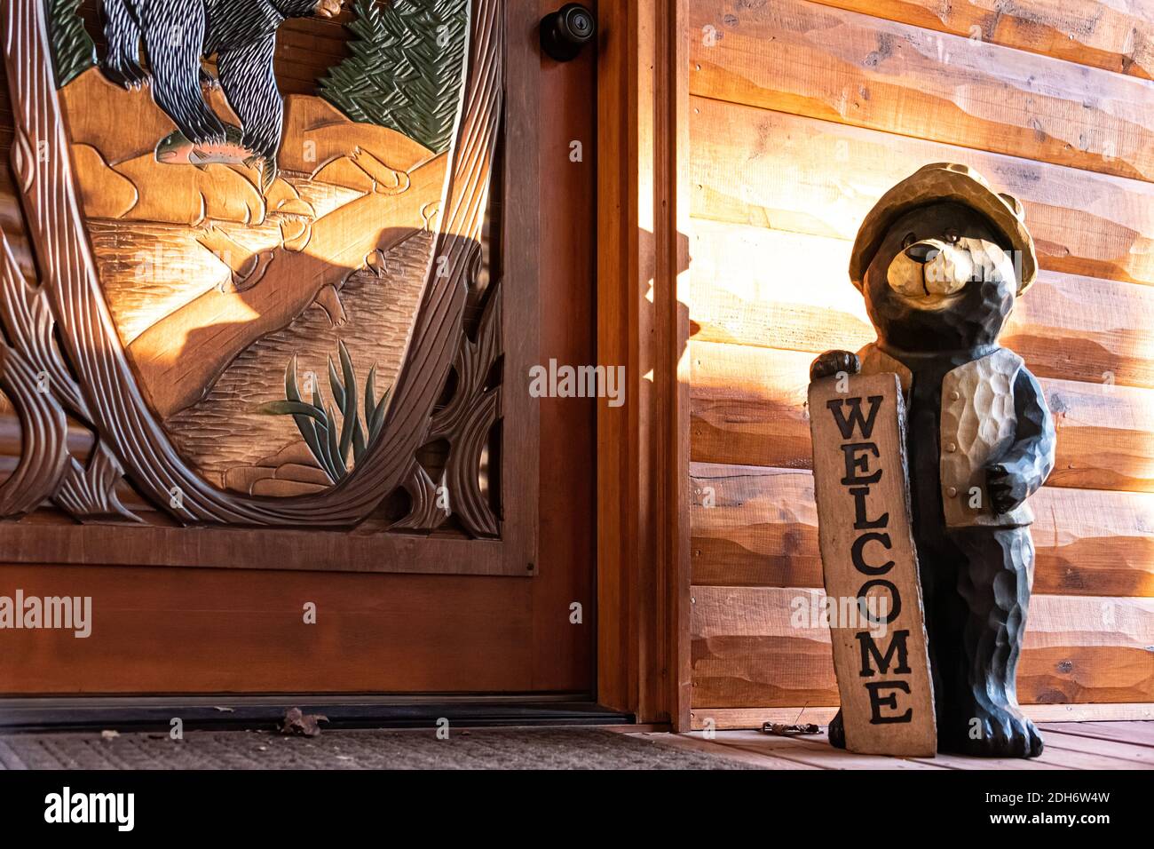 A welcoming entryway with black bear decor at a luxury mountain cabin in the Blue Ridge Mountains of North Georgia. (USA) Stock Photo