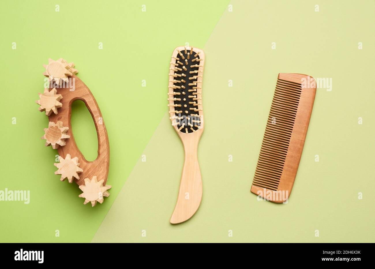 Various household items from recyclable  materials on a green background Stock Photo