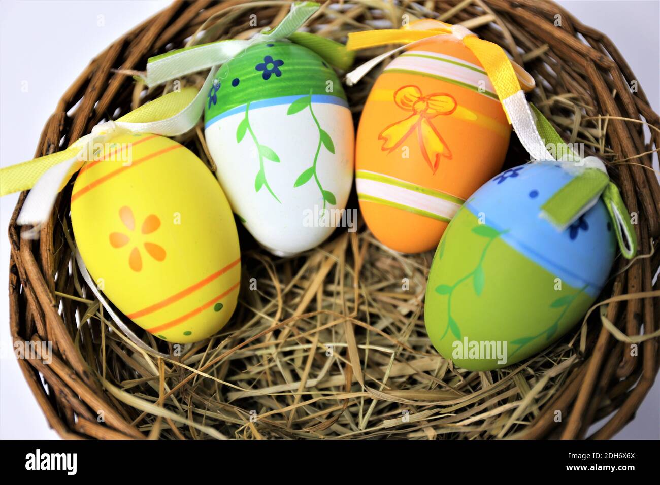 easter eggs in basket on white background Stock Photo