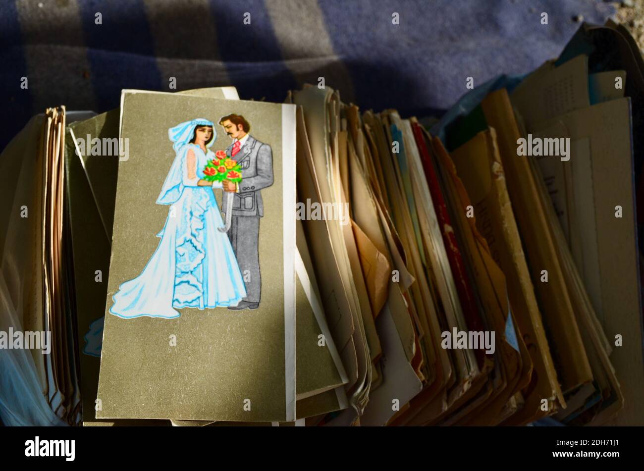 An old wedding card sold at a street market in Tbilisi, Georgia Stock Photo