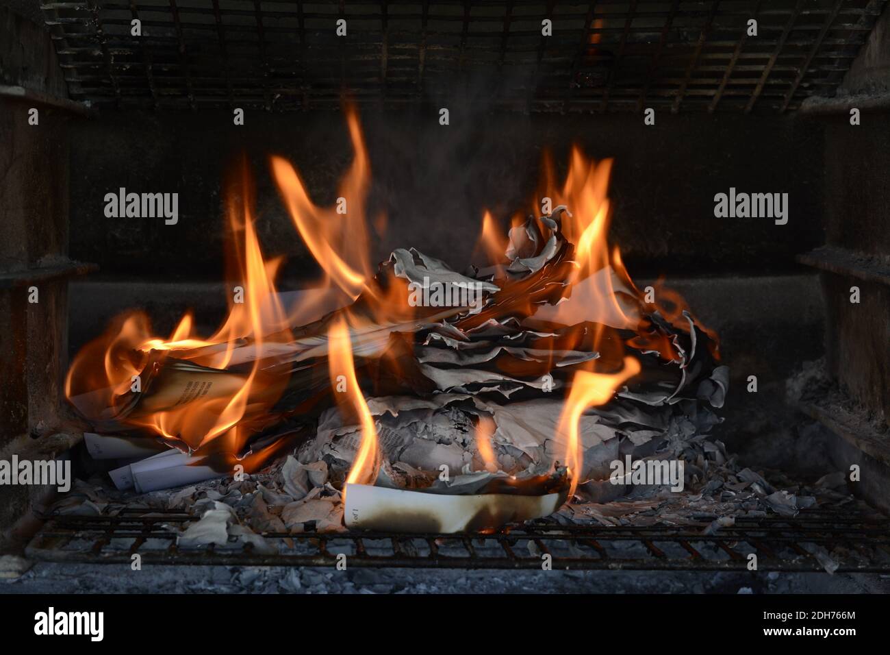 Burning paper documents. Flames and scorched paper. Good example of