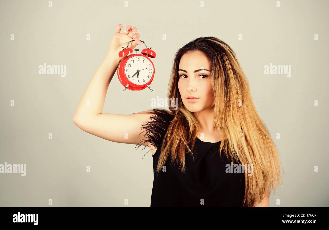 Ladies Time Sign Pretty girl managing her time. Woman hold vintage alarm clock. Watch ...