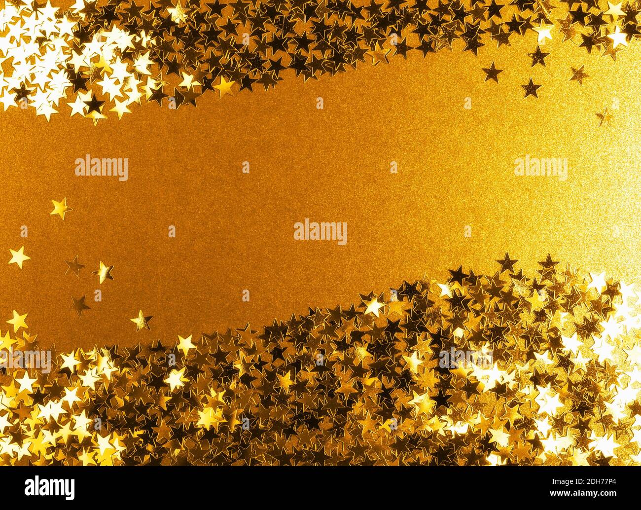 Gold background with shiny confetti stars. Festive backdrop. Christmas ...