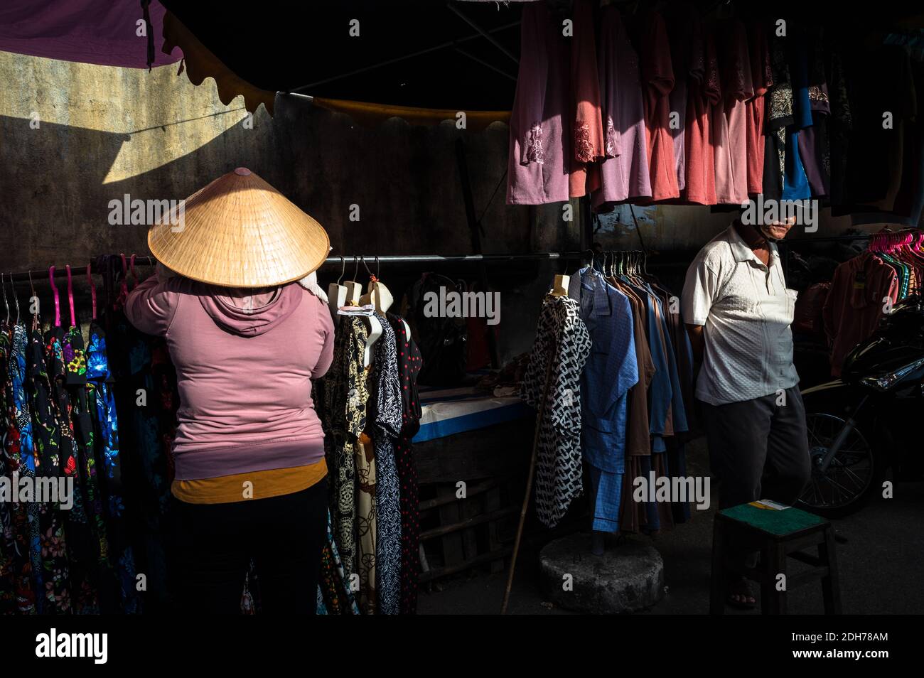 Woman working at her clothing stall, Phuoc Hai, Vietnam Stock Photo