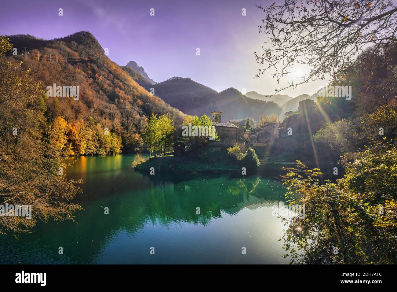 Isola Santa medieval village, lake and Alpi Apuane mountains in autumn foliage. Garfagnana, Tuscany, Italy Europe. Stock Photo
