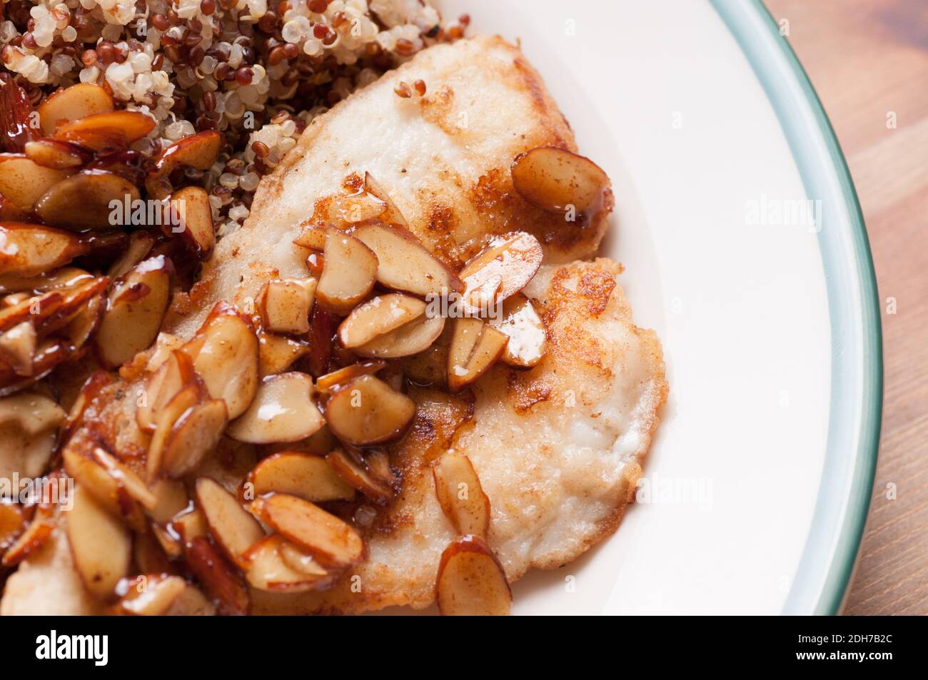 roasted almonds in a lemon sauce over pan fried sole and quinoa Stock