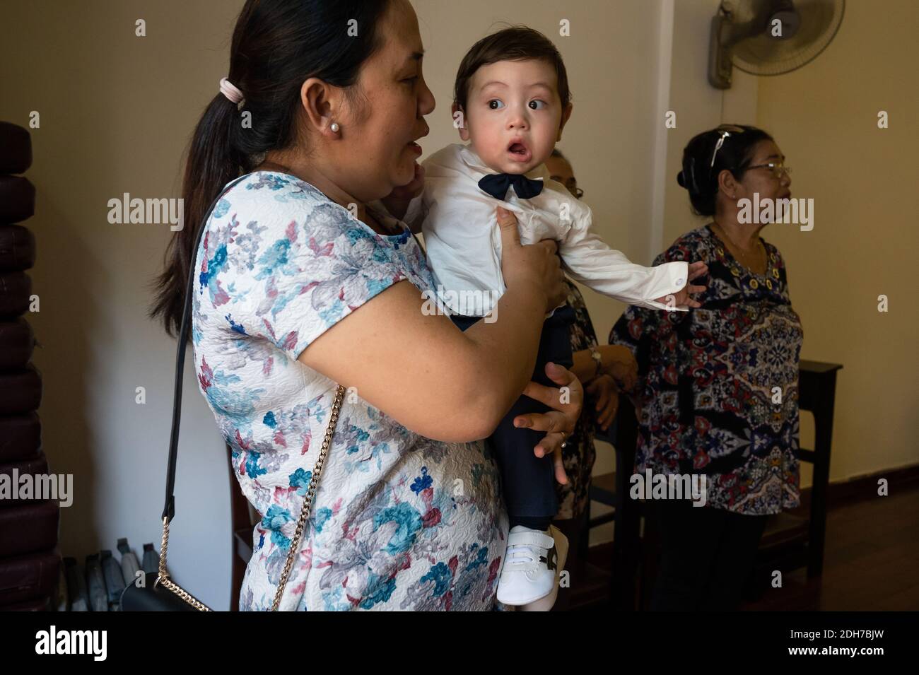 Portrait of a Eurasian Vietnamese baby boy and his Vietnamese relatives, Ho Chi Minh City, Vietnam Stock Photo