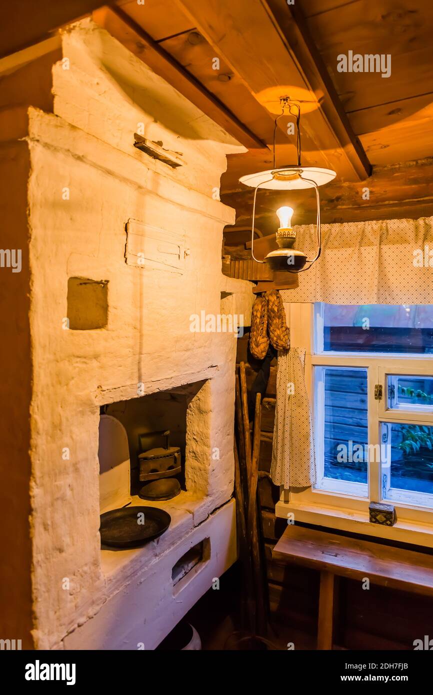 Rustic stove in the countryside - the interior of a wooden house Stock Photo