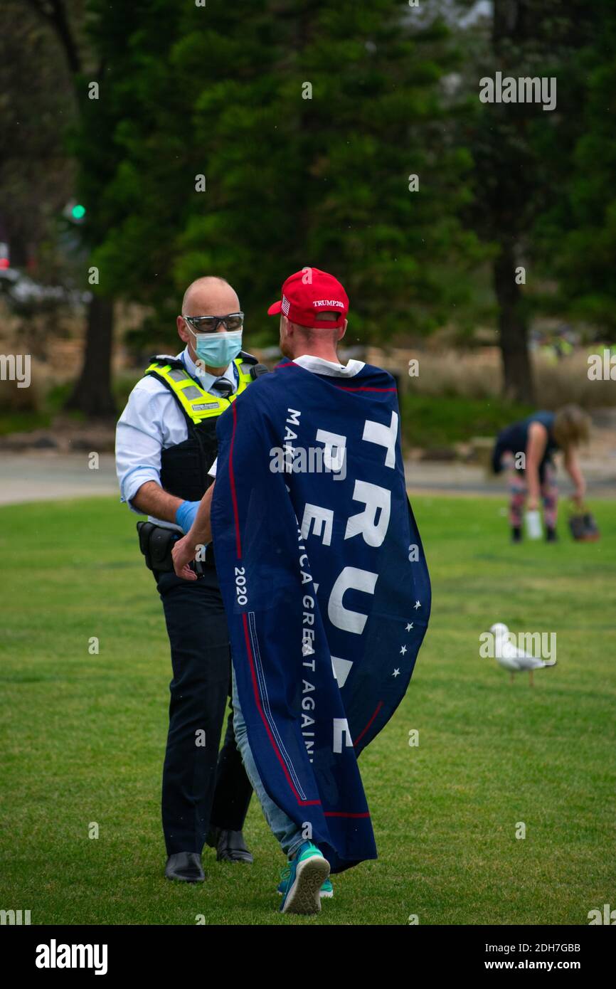 Melbourne, Victoria. 5 December 2020. Melbourne Freedom Rally. A Trump supporter speaks with police. Credit: Jay Kogler/Alamy Live News Stock Photo