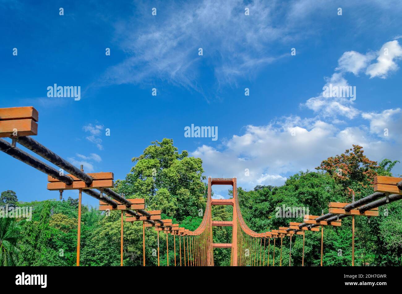 Top of an old, rusty Hanging Bridge in Ezhattumugham, Athirappilly, Kerala, India, with a clear blue sky background Stock Photo