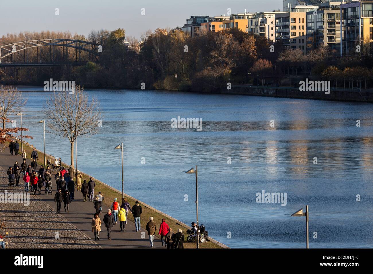 People walking along the Main river in Frankfurt am Main, Hesse, Germany. Stock Photo