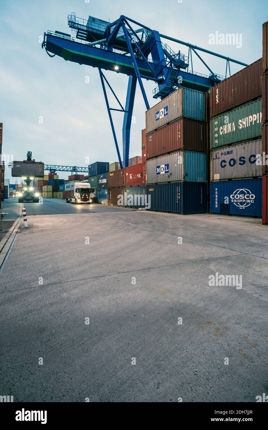 Container loading with a crane in Osthafen, Frankfurt am Main, Hesse , Germany Stock Photo