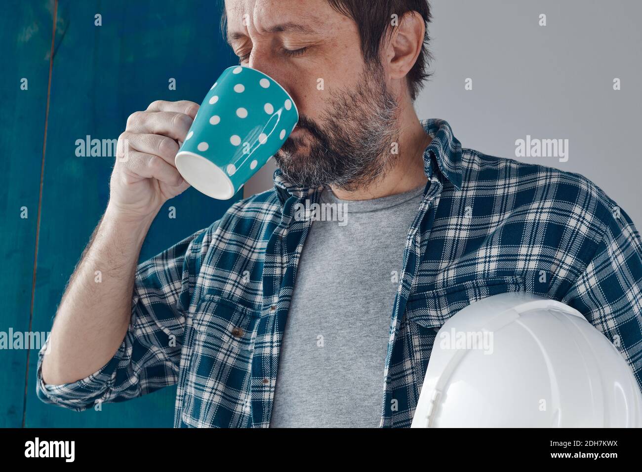 Construction engineer on a morning coffee break, relaxing and preparing for work Stock Photo