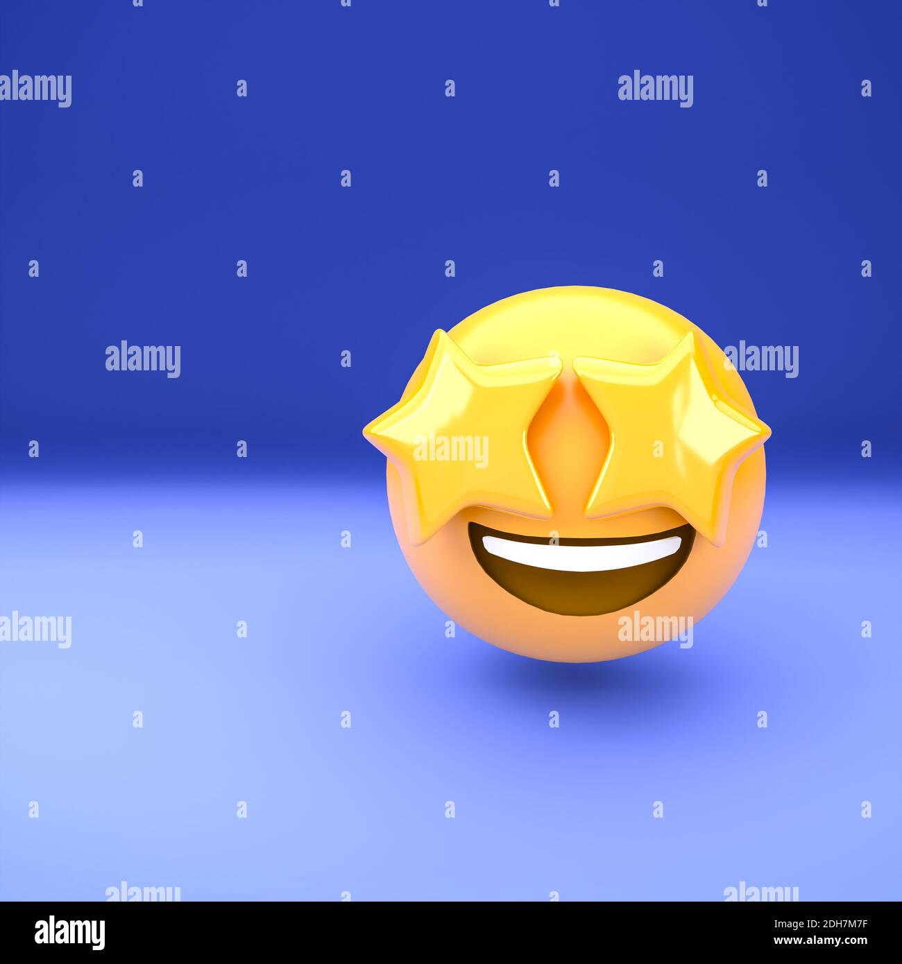 3d emoji face with stars as eyes on a blue background. Star-struck. Stock Photo