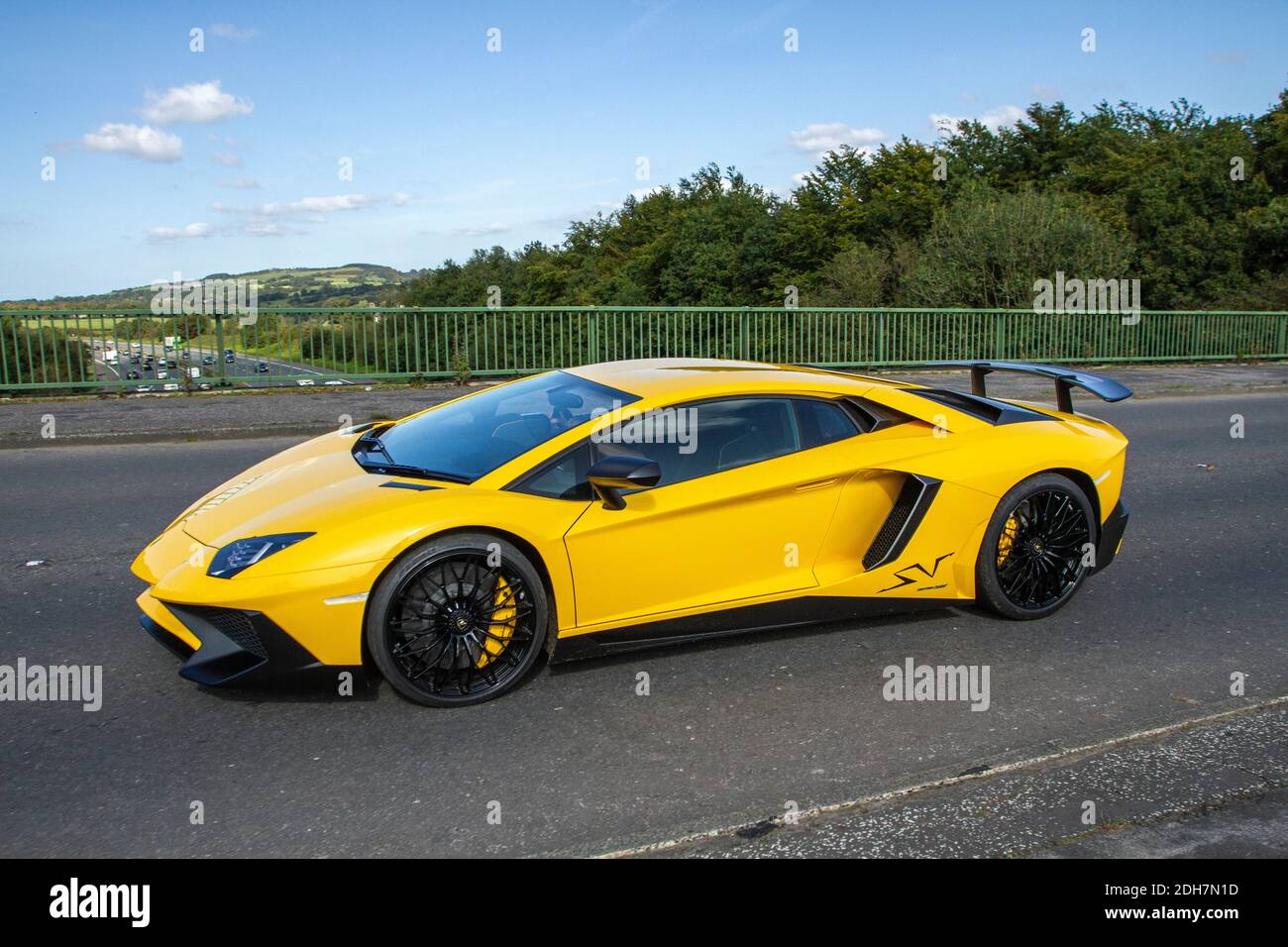 2016 yellow Lamborghini Aventador LP 750-4 SV S-A coupe sports car;  Vehicular traffic moving vehicles, cars driving vehicle on UK roads,  motors, roadster motoring UK highway network Stock Photo - Alamy