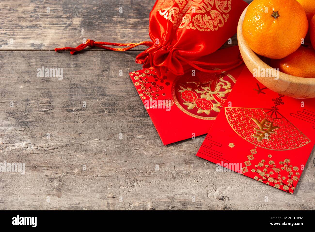 Chinese new year festival decorations and oranges on wooden background