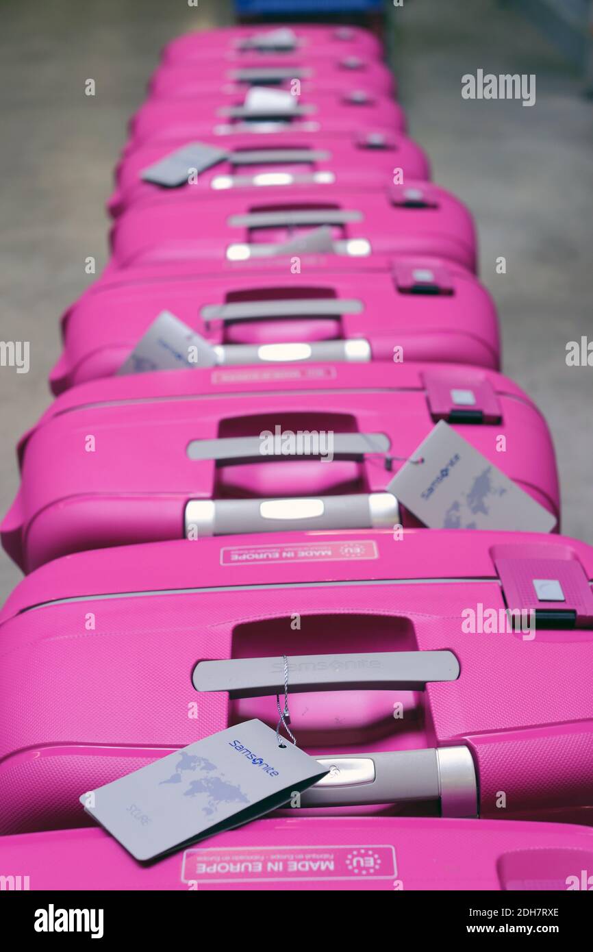 Pink suitcases in a row Stock Photo