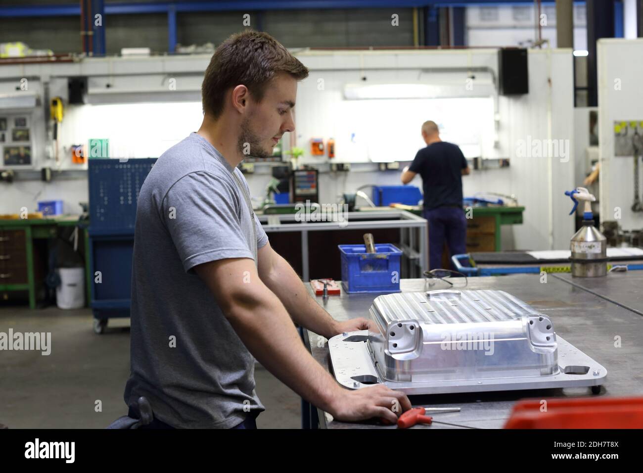 A worker at Samsonite is creating the mold tool out of aluminium for manufacturing suitcases at the Samsonite production site in Oudenaarde Belgium Stock Photo Alamy