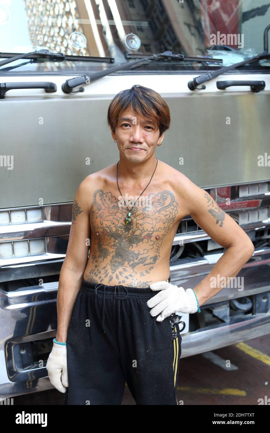 A shot of a tattoed male truck driver in hong kong Stock Photo