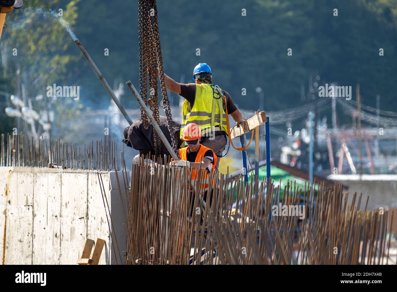 Unrecognizable builders working in port Stock Photo