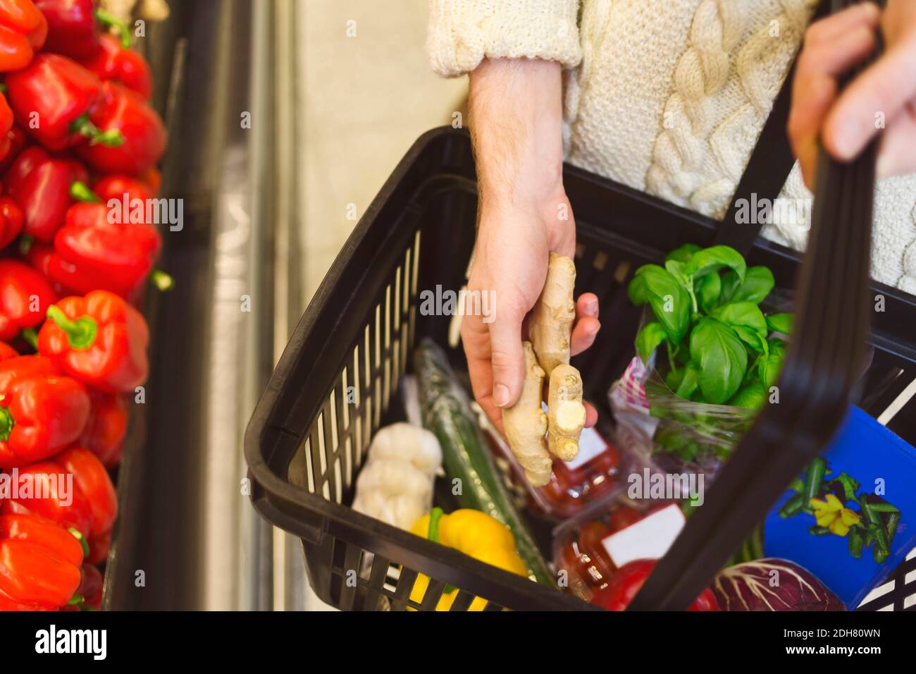 Midsection of man buying groceries at supermarket Stock Photo