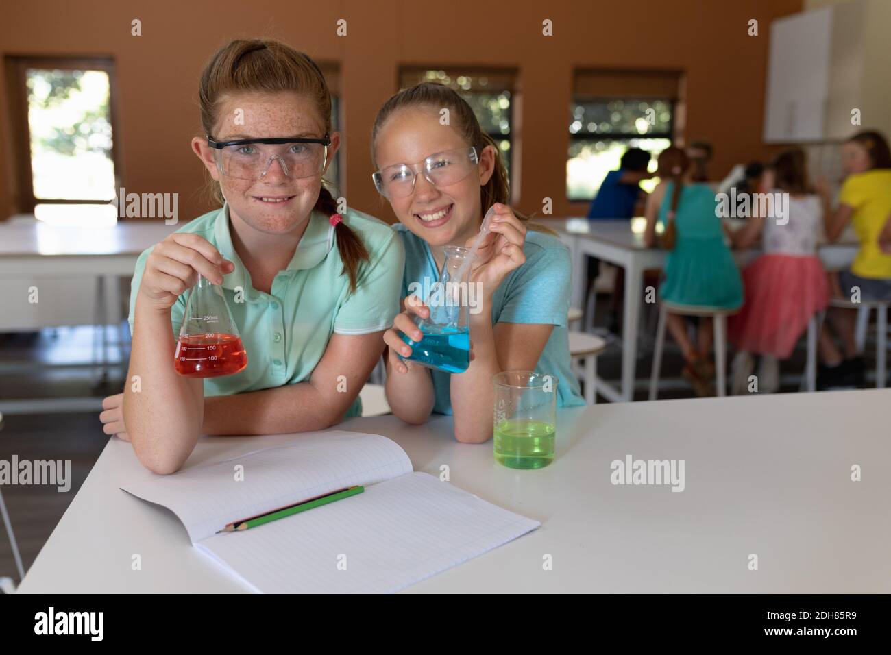 Two elementary school girls in chemistry class Stock Photo Alamy