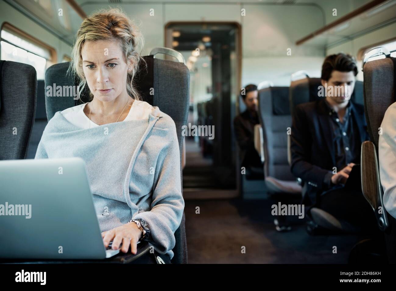 Business people traveling in train Stock Photo