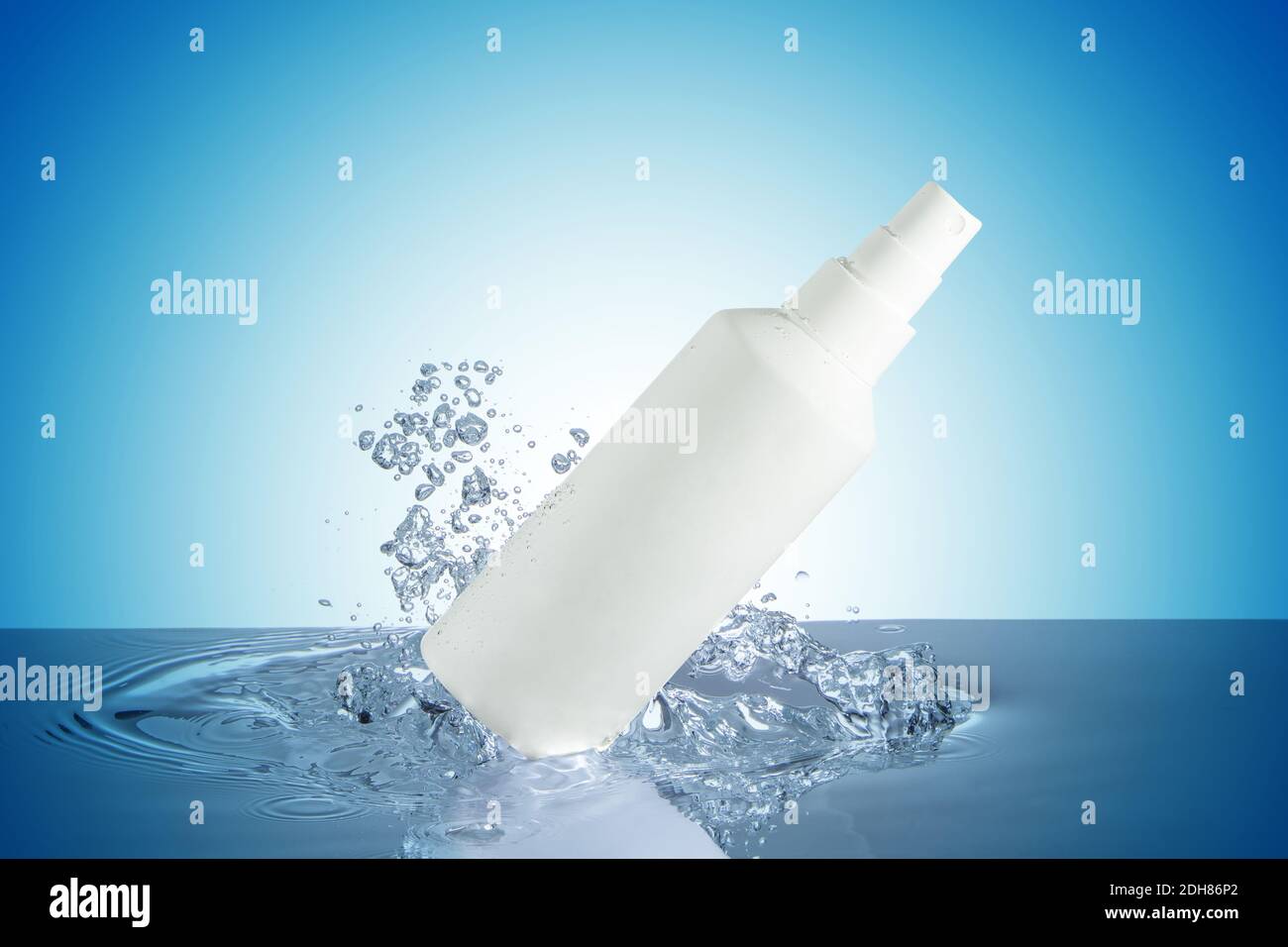 sprayer and bubbles on water surface isolated on blue background Stock Photo