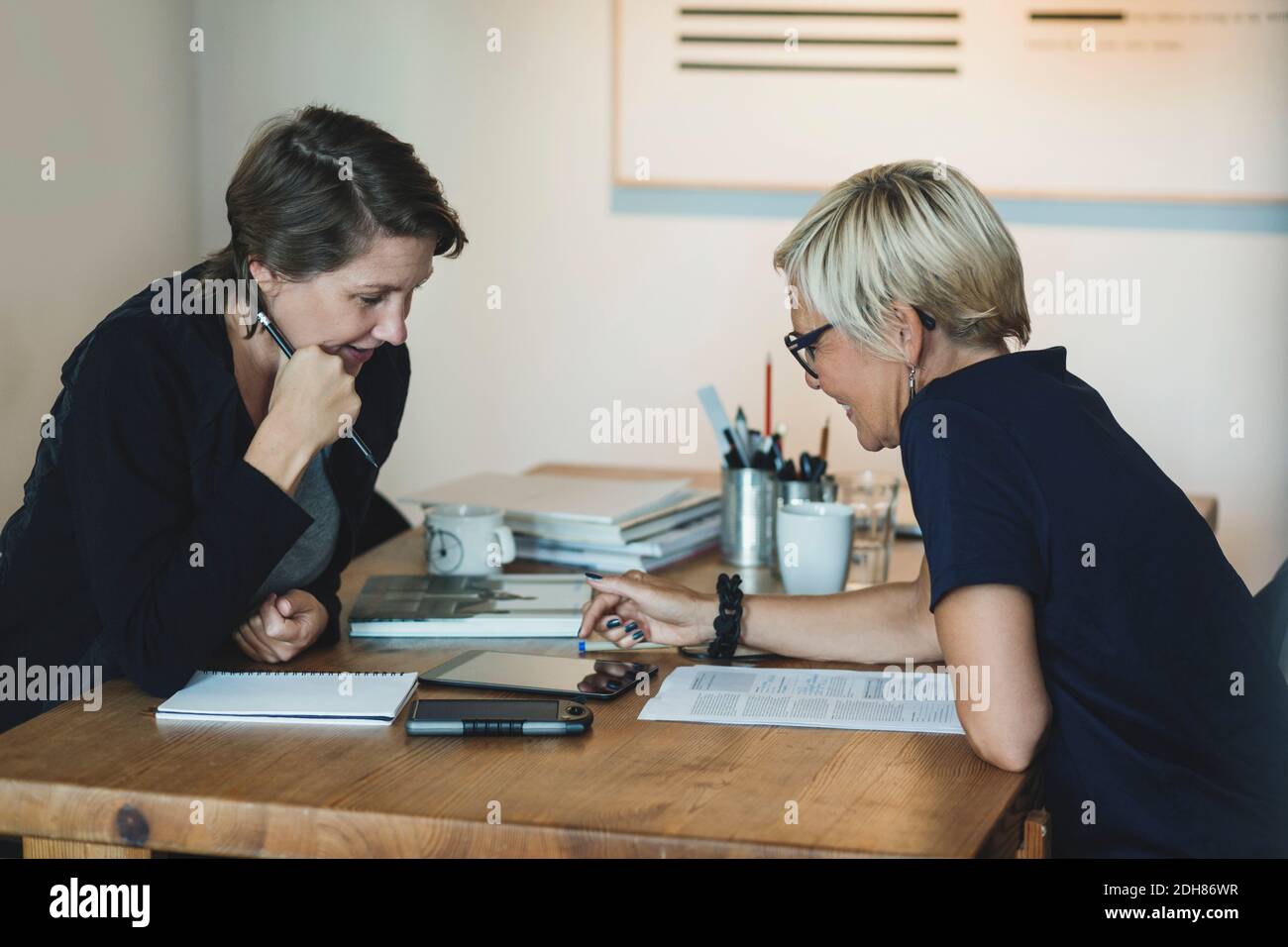 Product designers using digital tablet at home office Stock Photo
