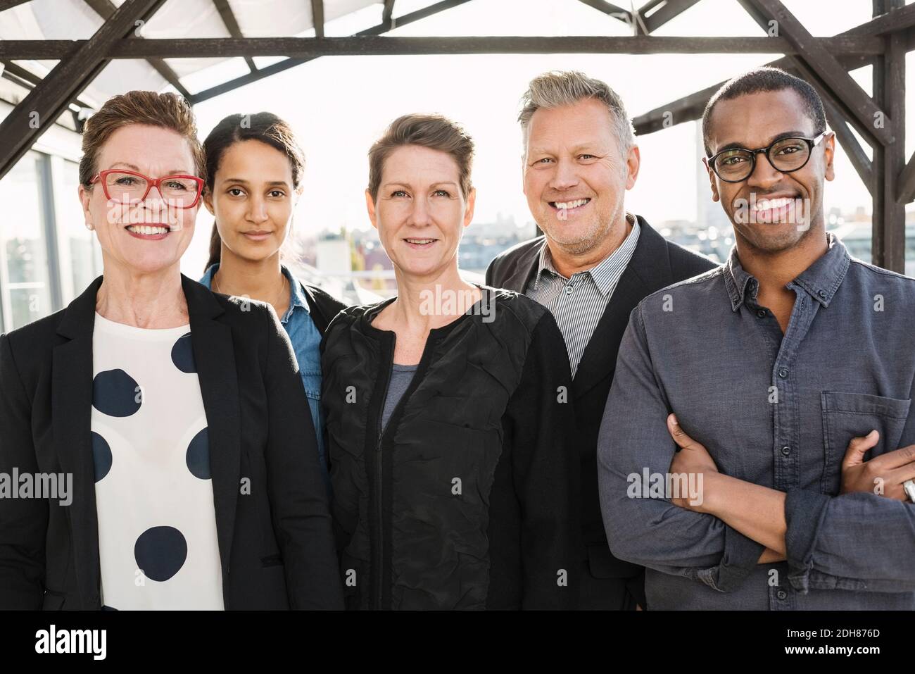 Portrait of multi-ethnic confident business people standing at office Stock Photo
